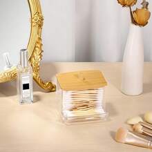 حامل أعواد القطن من الأكريليك مع غطاء من البامبو، موزع أعواد القطن الصغيرة الشفافة، حامل أعواد الأذن، حاوية تخزين أعواد الأسنان، منظم تخزين ديكوري لسطح الحمام، مجموعة غرفة النوم