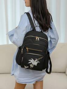 Black Floral Embroidered Multifunctional Backpack - A Fashionable Companion For Study, Commute And Travel. This Backpack Combines Practicality And Aesthetics: The Main Body Is Made Of Durable Black Fabric, Decorated With Delicate Light-Colored Floral And Butterfly Embroidery On The Front.