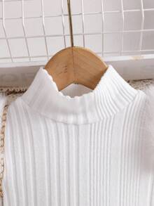 2 piezas Conjunto de niña bebé con camiseta de manga larga de cuello alto minimalista y falda plisada con moño, adecuado para salidas