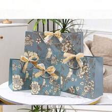 1 件创意节日礼品包装袋、蝴蝶结丝带提手纸袋、情人节礼品袋、生日礼品袋、宰牲节分发、儿童开斋节礼物、礼品袋