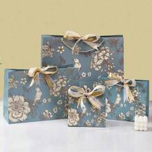 1 件创意节日礼品包装袋、蝴蝶结丝带提手纸袋、情人节礼品袋、生日礼品袋、宰牲节分发、儿童开斋节礼物、礼品袋