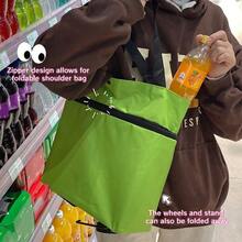 带轮子的可折叠便携式购物袋，大容量家用杂货袋，也适用于超市购物、户外活动等场景，专为追求方便实用的人士设计，易于使用和存储。
