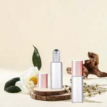 AGENIZ - 50 botellas de vidrio transparente para aceite esencial, botellas enrollables de 5 ml con bolas de acero inoxidable, botella enrollable recargable (transparente, 5 ml) - 1 - Ver 6