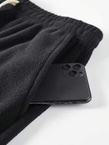 男士纯色抓绒休闲裤，适合秋冬季节穿着，配有可调节抽绳腰带，适合健身，可机洗，纯色设计，穿着舒适，弹性腰带，是户外徒步爱好者的理想礼物。