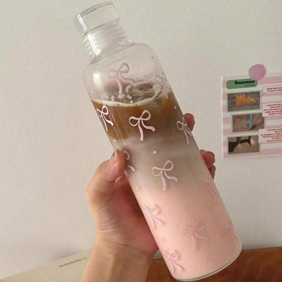 Botella de agua de plástico de gran capacidad con estampado de lazo y escala de medición, adecuada para la hidratación diaria