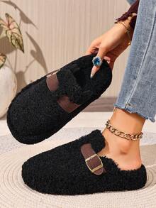 Mules plates noires pour l'automne/l'hiver, chaussons décontractés polyvalents et à la mode pour femmes avec bout rond, franges et boucle décorative