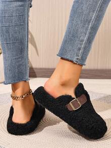 Mules plates noires pour l'automne/l'hiver, chaussons décontractés polyvalents et à la mode pour femmes avec bout rond, franges et boucle décorative