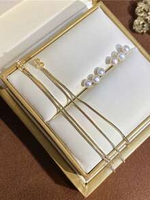 1 对优雅精致的珍珠流苏耳环，适合女性日常佩戴和约会