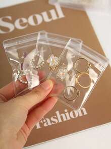 1 Pc Transparent Frosted Jewelry Storage Album, Plastic Manual Jewelry Storage Box, Jewelry Storage Book, Sealed Storage Bag, Containing 30 Rust-Proof Storage Bags, For Organizing And Classifying Rings, Earrings And Necklaces, Suitable For Girl's Carry-On Jewelry Storage, The Best Convenient Travel Jewelry Product.