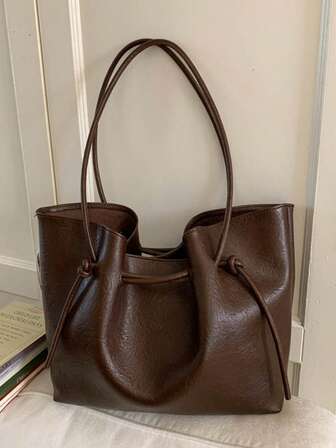 [Drawstring Statement | Deep Brown Lazy Tote Bag] This Deep Brown Tote Bag Reinterprets The Urban Lazy Aesthetic With A Draw Design! Made From High-Quality Materials, It Feels Soft To The Touch And Is Durable And Long-Lasting. The Top Drawstring Closure Creates A Casual Wrinkled Effect, And Wide, Color-Coordinated Hand Strap Is Comfortable And Doesn't Dig Into Your Hand.