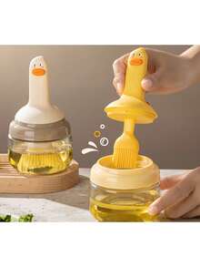 1 pieza Botella de aceite con forma de pato resistente al calor, con cepillo incorporado, mango de silicona, puede contener aceite, apta para hornear y asar a la parrilla, fácil de limpiar, herramienta de cocina linda, todo en un solo botella de aceite