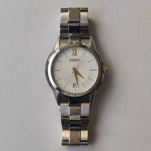 Seiko Reloj de cuarzo para hombre, correa de acero plateado y dorado, esfera blanca, adecuado para uso diario de negocios SGEF45J1