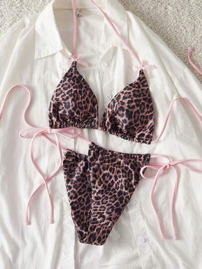 女士泳衣，粉色蝴蝶结和豹纹拼接，可爱性感风格，适合万圣节派对装扮，送给她的度假礼物