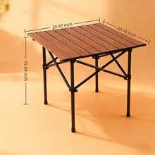 The Folding Camping Table Features A Roll-Up Surface, Comes With A Storage Bag, Has Adjustable Height, And Is Lightweight. It Is Suitable For Beaches, Picnics, Barbecues And Indoor Use.