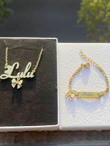A Set Of Personalized Name Jewelry With Bows, Suitable For Girls. It Includes A Personalized Name Pendant, A Cute Necklace, And A Bracelet. It Can Be Used As A Gift Or A Birthday Present. - Golden Bow - View 5
