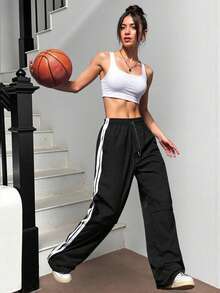 Pantalones deportivos casuales negros de pierna ancha para mujer con rayas laterales blancas, cintura con cordón y bolsillos. - Negro - Ver 6
