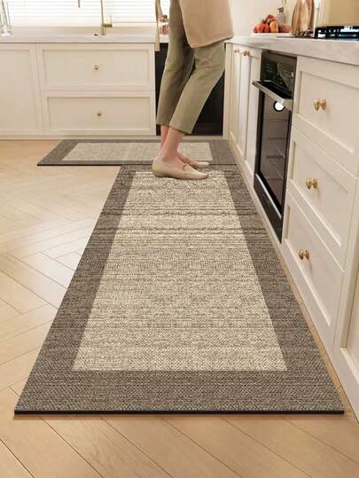 1pc Silica Gel Kitchen Mat, Minimalist Dual-Color Patchwork Pattern. The Main Body Of The Mat Is Light Beige With A Fine, Woven-Like Texture, And The Edge Is Deep Brown, Forming A Clear Regional Division. The Overall Design Is Simple And Elegant. The Kitchen Mat Has A Luxurious And Fashionable Style, Cushioning And Anti-Fatigue, With A Fabric Surface And Sponge Absorbent Material In The Middle.