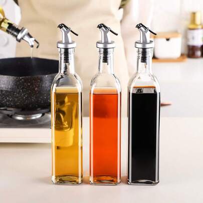 1 chai thủy tinh đựng dầu chống rò rỉ - Bình đựng nhà bếp chống ăn mòn với nắp kín khí, thích hợp đựng dầu mè, giấm và nước tương - Không chứa chì, tuyệt vời cho nấu ăn và trang trí.