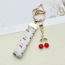 1 mặt dây chuyền hình nơ lụa in hình quả anh đào bằng tia UV, với mặt dây chuyền hình quả anh đào đáng yêu. Có thể treo trên chìa khóa cửa, túi xách, nhẹ và thời trang, hoàn hảo cho nữ chủ xe! - Nhiều màu - Xem 6
