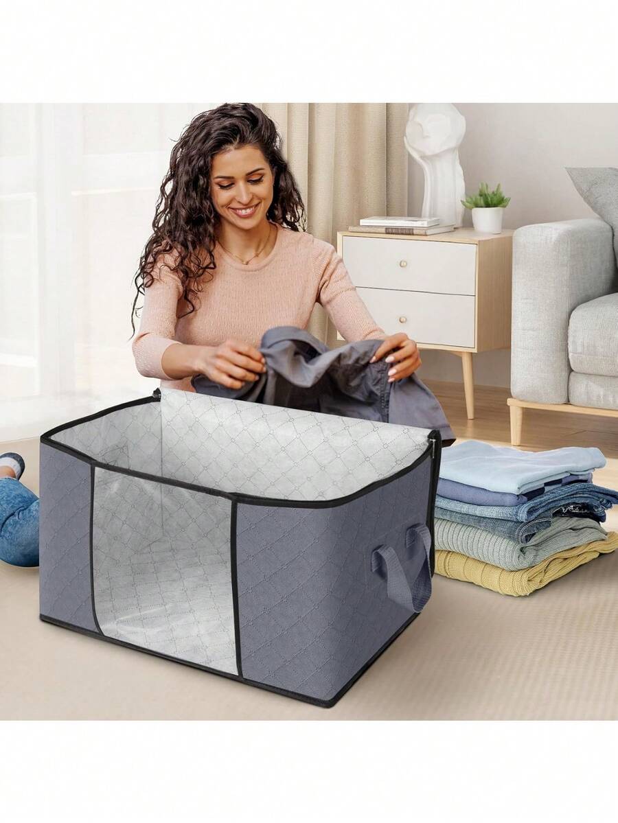 Bolsa plegable de gran capacidad, ideal para organizar ropa, edredones y ropa de cama. Cuenta con una ventana transparente y asas. Imprescindible para el almacenamiento estacional. - Gris - Ver 1