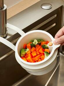 Over-The-Sink Hanging Basket. Residue-Filtering Mesh. Adjustable Hanging Feature. Debris Collection Bucket. Space-Saving Drain Basket. Single-Button Drainage And Independent Filtration System. Easy-To-Clean Sink Organizer For Kitchen And Bathroom. Durable Plastic Construction. Kitchen Sink Basket. Food Waste Disposal. Compact Design. Sturdy Structure. Ideal For Home Cooks.