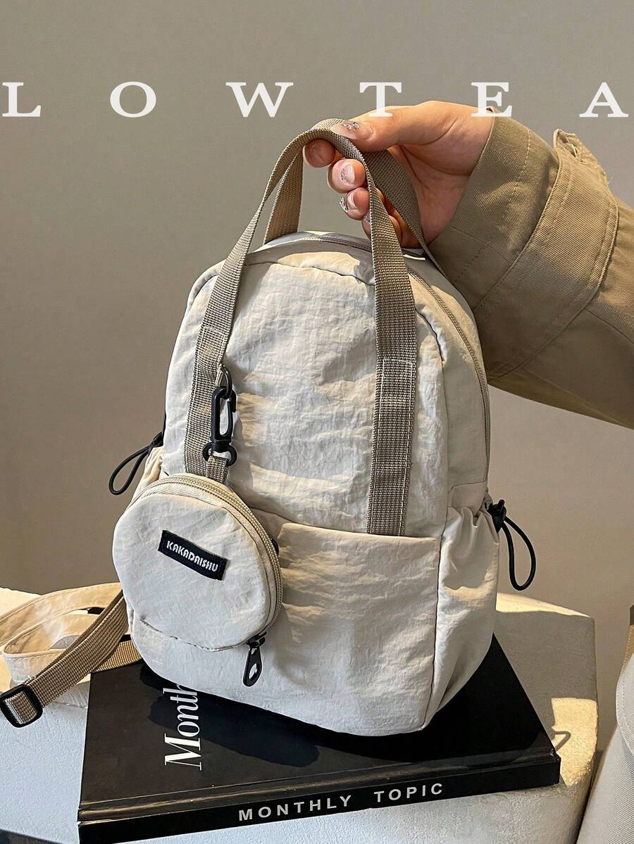 low tea 1 件男女通用纯色尼龙面料背包，可转换手提包和单肩包，适合大学生，拉链开合，日常使用 - 米色 - 查看 1