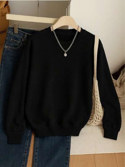 Sudadera lisa unisex de manga larga con cuello redondo y puños ajustados, estilo cárdigan. Ideal para looks casuales o de entretiempo.