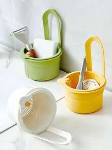 Over-The-Sink Hanging Basket. Residue-Filtering Mesh. Adjustable Hanging Feature. Debris Collection Bucket. Space-Saving Drain Basket. Single-Button Drainage And Independent Filtration System. Easy-To-Clean Sink Organizer For Kitchen And Bathroom. Durable Plastic Construction. Kitchen Sink Basket. Food Waste Disposal. Compact Design. Sturdy Structure. Ideal For Home Cooks.