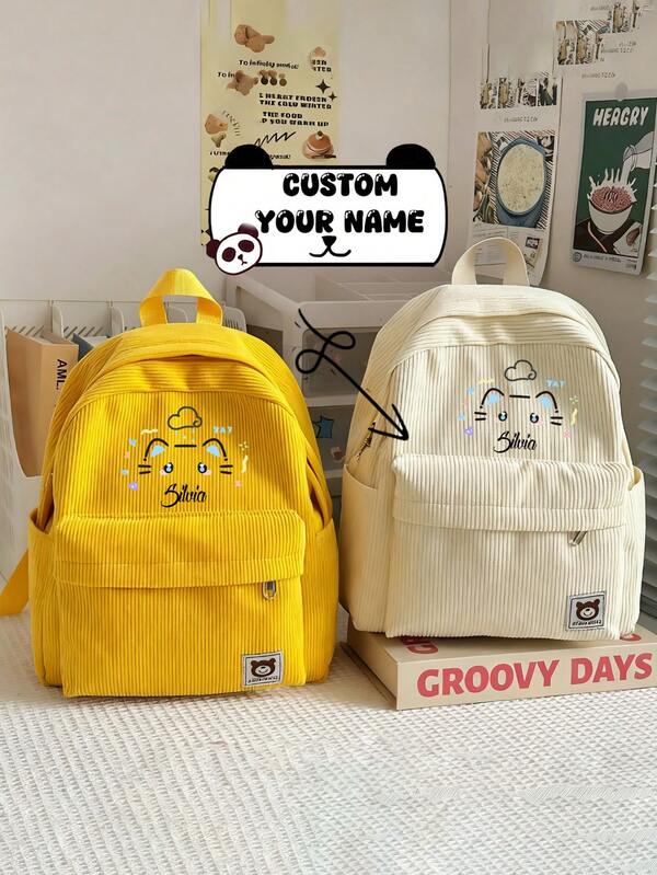 Esta mochila de pana de gran capacidad personalizada presenta una adorable impresión de gato de dibujos animados. Se puede personalizar con su nombre y viene en una variedad de colores, perfecto para otoño e invierno. El material y los colores son ideales para la temporada. También puede tener su nombre o saludos festivos impresos en ella. Adecuado para uso diario, esta mochila es perfecta para actividades diarias y viajes, y también hace un regalo maravilloso para amigos y familiares.