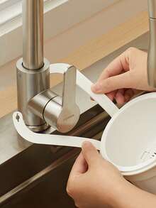 Over-The-Sink Hanging Basket. Residue-Filtering Mesh. Adjustable Hanging Feature. Debris Collection Bucket. Space-Saving Drain Basket. Single-Button Drainage And Independent Filtration System. Easy-To-Clean Sink Organizer For Kitchen And Bathroom. Durable Plastic Construction. Kitchen Sink Basket. Food Waste Disposal. Compact Design. Sturdy Structure. Ideal For Home Cooks.