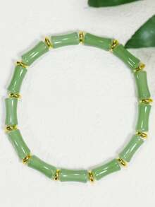 手工制作的中国风竹结手链，配以绿色人造水晶珠和金色隔珠 - 象征着丰收、繁荣和好运，适合女性日常佩戴或节日礼物（新年幸运符），竹手链，竹结设计，精致的串珠工艺，节日配饰，时尚珠宝，手工制作的外观