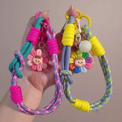 Cordón para teléfono con colgante de girasol, correa de muñeca trenzada ajustable, anillo para dedo y cable de teléfono de doble uso, correa de mano anti-pérdida para actividades al aire libre y viajes, nuevo