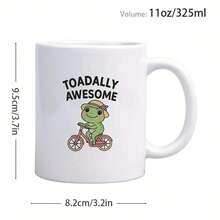 1pc 11oz Ceramic Coffee Mug With "TOADALLY AWESOME" Frog Riding Bike Design - Dishwasher , 3A Grade Ceramic, Christmas Gift Idea For Soul Sister, Brothers, Quirky Kitchenware, Coffee Lover Gifts, Reusable Drinkware, Playful Illustration, Durable Drinkware, Vibrant Colors - trắng - Xem 2