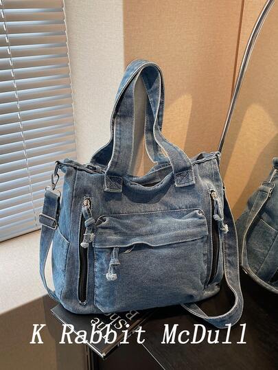 新款时尚休闲多口袋牛仔手提包，多功能通勤大容量女士单肩包，学院风学生书包，中号牛仔斜挎包，适合工作通勤、购物、日常使用和上学，完美契合牛仔女孩风格