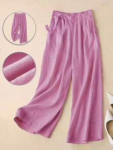 春夏新品，通勤休闲两相宜，优雅玫瑰红高腰侧系带阔腿裤。垂坠感亚麻混纺面料，七分裤长。松紧腰设计，显瘦拉长身形。口袋设计，舒适透气。纯色百搭，适合通勤和日常休闲穿着。宽松版型，时尚优雅。女士情人节穿搭，女士度假穿搭