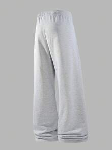 男士宽松时尚运动裤，休闲简约纯色阔腿设计，腰部配有抽绳和大口袋，轻便舒适，适合日常步行、工作、旅行等场合。