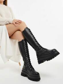 Grinta 过膝黑色仿皮厚底踝靴