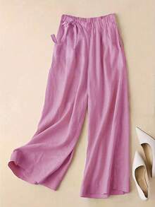 春夏新品，通勤休闲两相宜，优雅玫瑰红高腰侧系带阔腿裤。垂坠感亚麻混纺面料，七分裤长。松紧腰设计，显瘦拉长身形。口袋设计，舒适透气。纯色百搭，适合通勤和日常休闲穿着。宽松版型，时尚优雅。女士情人节穿搭，女士度假穿搭