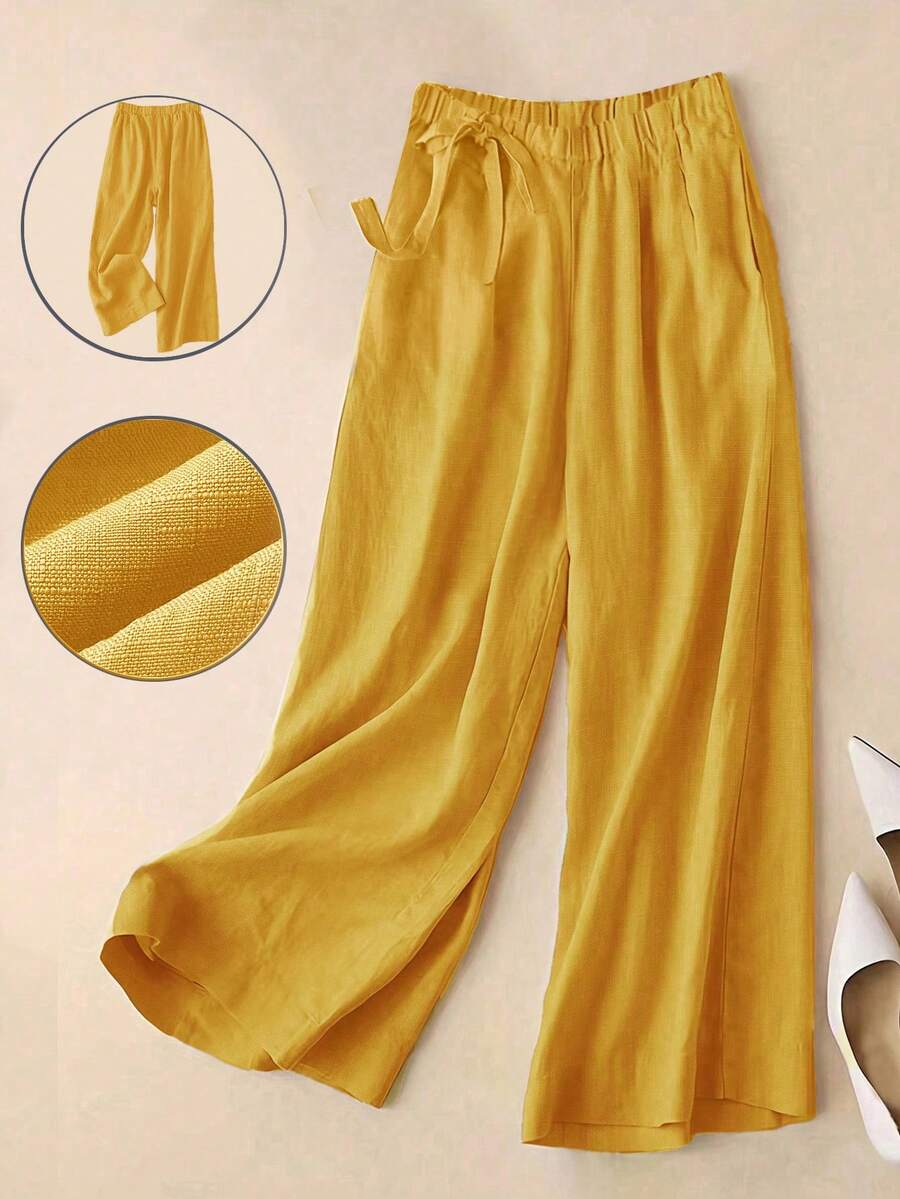 Mẫu quần mới Xuân/Hè, thích hợp cho công sở và mặc thường ngày, cạp cao buộc dây bên hông, ống rộng, dài 7/8, lưng thun co giãn tạo cảm giác thoải mái và thoáng khí. Màu trơn đa năng, phù hợp cho công sở và mặc hàng ngày. Kiểu dáng rộng rãi, thời trang và thanh lịch. Thích hợp cho ngày Valentine, kỳ nghỉ. - Màu vàng - Xem 1