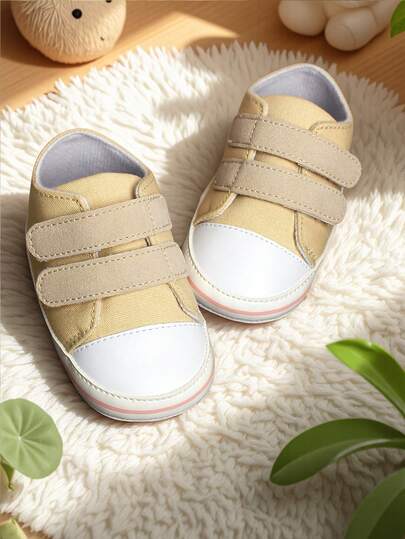 1 đôi giày thể thao vải bố cho trẻ nhỏ, đế mềm chống trượt, nhẹ, thoáng khí, mũi tròn, kiểu dáng thấp cổ, phù hợp cho bé từ 0-1 tuổi, mùa xuân/thu.