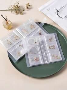 1 pieza Álbum de almacenamiento de joyas transparente y mate con 30 bolsas de almacenamiento antioxidantes, libro de almacenamiento de joyas, organizador de bolsas selladas, caja de almacenamiento de viaje para anillos, aretes, collares y otros accesorios, regalo de regreso a clases, regalo de viaje