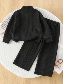 两件套女童休闲街头服饰，针织长袖上衣搭配阔腿裤，纯色格子套装，适合居家和户外休闲穿着。 - 黑色 - 查看 2