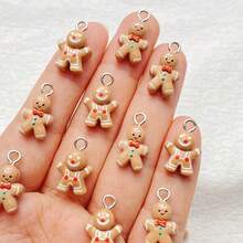 16/26 szt. Eleganckich, miniaturowych zawieszek z motywem piernikowego ludzika z żywicy z kreskówkową grafiką – różne zawieszki do naszyjników, bransoletek, kolczyków, breloków i dekoracji opakowań – perforowane, idealne jako dodatek do prezentów, prezent świąteczny