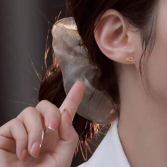 A Pair Of Copper Alloy Asymmetrical Angel Wings Stud Earrings