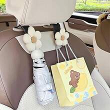 2 Stück gewebte Blumen Autositz Rückenlehnen Haken, multifunktionale Cartoon Autositz Kopfstützen Haken, auch vielseitig einsetzbare Vordersitz Aufhänger. Praktisch für den Gebrauch im Auto, hergestellt aus strapazierfähigem ABS-Harz Material, nicht nur mit guter Aufbewahrungshaken-Funktion, sondern auch mit einem Hauch von Wärme und Spaß im Autoinneren durch das gewebte Blumen- und Cartoon-Design.