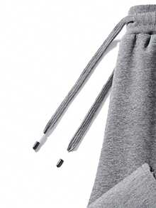 Męskie spodnie sportowe na co dzień, miękkie i wygodne, z kieszeniami zapinanymi na zamek i regulowanym ściągaczem, odpowiednie na każdą porę roku. Jednolity kolor, swobodny i uniwersalny styl, idealny do biegania na świeżym powietrzu, biwakowania i pieszych wędrówek.