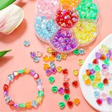 Un set de 140 piezas de cajas con flores de ciruelo en varios colores de cuentas dispersas de estrella de cinco puntas de color acrílico AB, utilizadas para hacer accesorios de joyería DIY para cadenas de teléfonos móviles