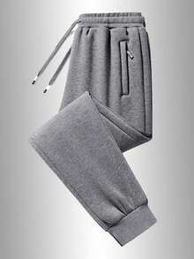 Męskie spodnie sportowe na co dzień, miękkie i wygodne, z kieszeniami zapinanymi na zamek i regulowanym ściągaczem, odpowiednie na każdą porę roku. Jednolity kolor, swobodny i uniwersalny styl, idealny do biegania na świeżym powietrzu, biwakowania i pieszych wędrówek.