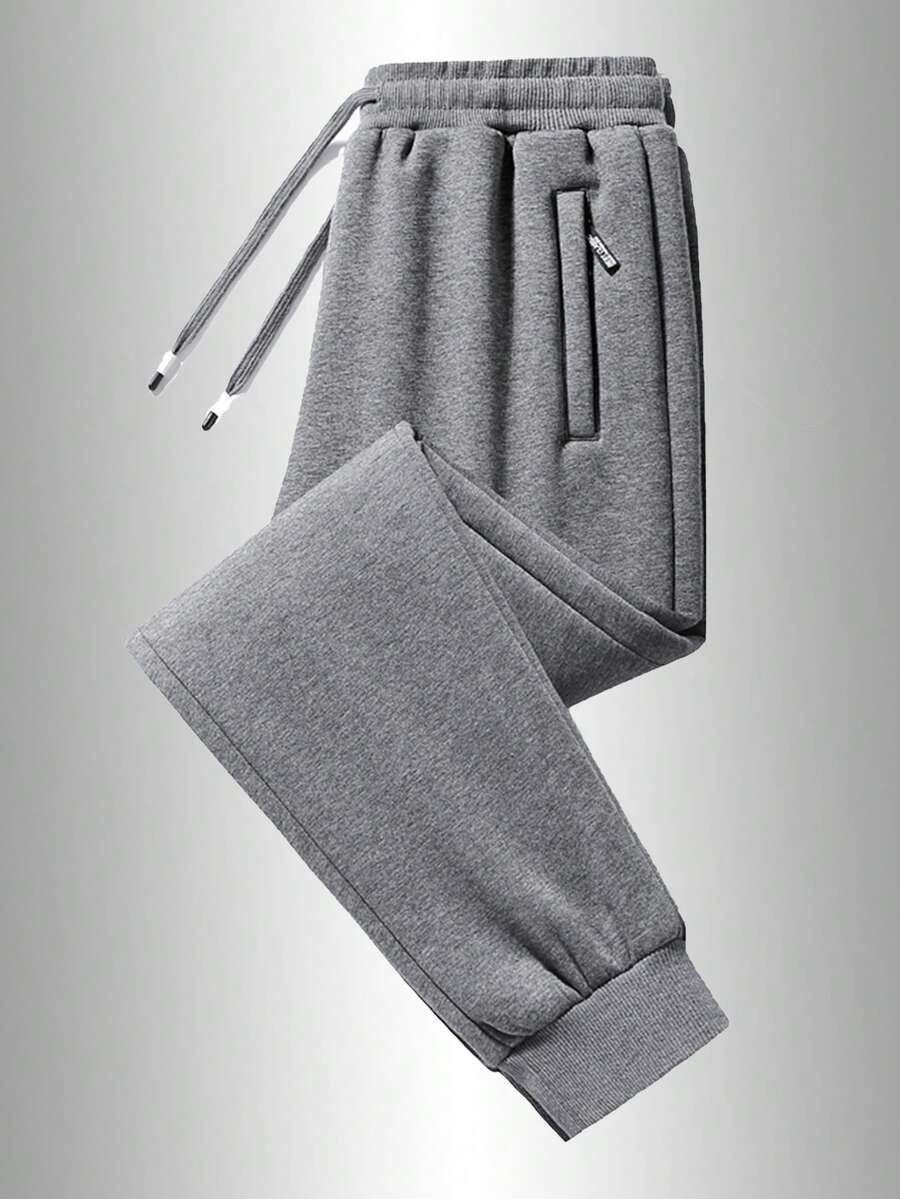 男士休闲运动裤，柔软舒适，配有拉链口袋和可调节抽绳，适合所有季节。纯色设计，休闲百搭，是户外跑步、露营和徒步旅行的理想之选。春季 - 灰色 - 查看 1