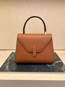 Handteller-Tasche, strukturierte Optik, rosé Farbton, eleganter und vielseitiger Stil